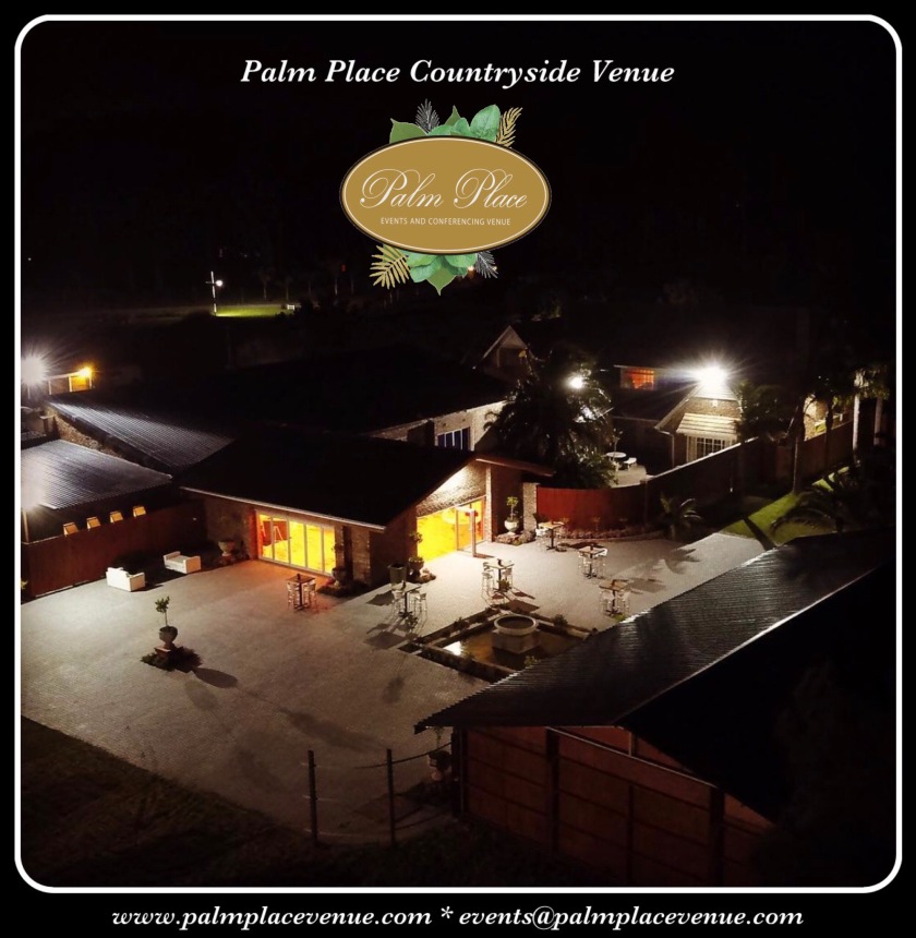 Night aerial view of Palm Place branded